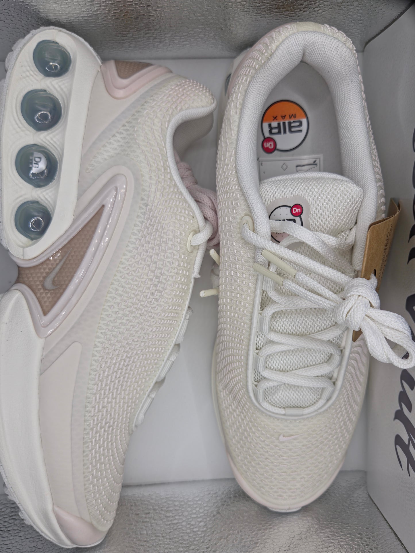 Nike Air Max Dn in a white and metallic silver